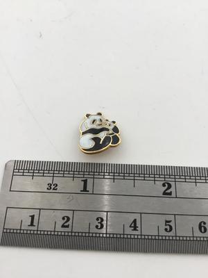 Gold tone unmarked panda small pin