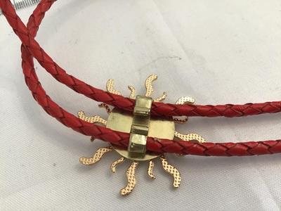 Red Cord Sun Bolo Tie