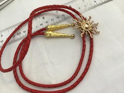 Red Cord Sun Bolo Tie