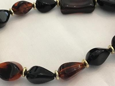 Amber Tone Tortoise Colored Black Faux Bead with Gold Tone Dpacers