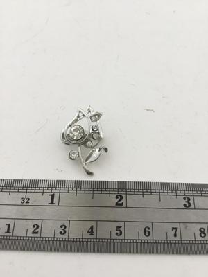 Silver tone rose pin