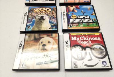 Lot #14 Vintage Nintendo - Lot of 7 Games with book