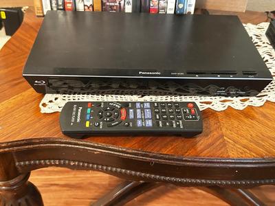 PANASONIC BLU-RAY DISC PLAYER W/REMOTE, DVD’S AND A VARIETY OF MUSIC ON CD’S