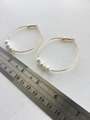 Gold tone faux pearl hoop earrings