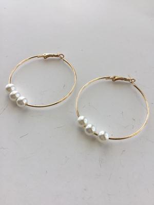 Gold tone faux pearl hoop earrings