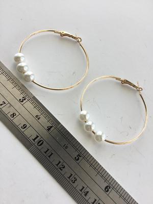 Gold tone faux pearl hoop earrings