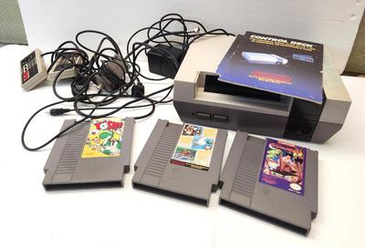 Lot #77 Nintendo Game Station with 3 games, 2 controllers