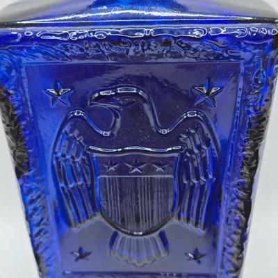 LOT 125: Bicentennial Placemats and Napkins, ARC France Glass Cannister, Hull Pottery Alpine Pretzel Jar, and More