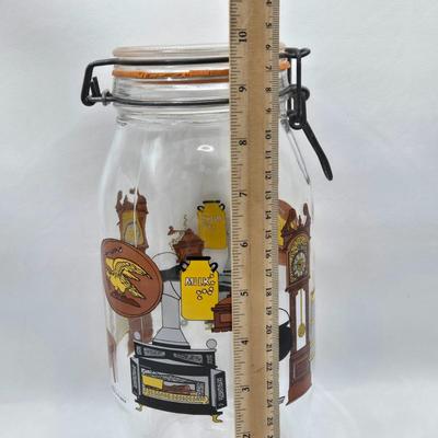 LOT 125: Bicentennial Placemats and Napkins, ARC France Glass Cannister, Hull Pottery Alpine Pretzel Jar, and More