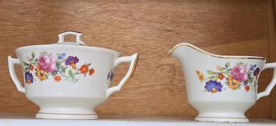 LOT 127: Cabinet Lot with Incomplete Sets of Old Ivory Syracuse China, Harmony House China Royal Duchess and More