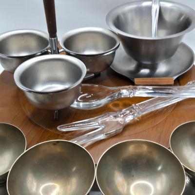 LOT 133: MCM Wooed Lazy Susan, Stainless Steel Condiment Server, Gravy Boat, 4 Silver Plated Dessert Cups and Glass Salad Serving Spoon...