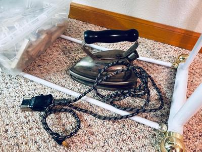 OLD UNIVERSAL ELECTRIC IRON WITH STAND, QUILT RACK, CLOTHES PINS, JAMES A MEGER ART THROW BLANKET