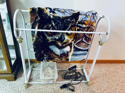 OLD UNIVERSAL ELECTRIC IRON WITH STAND, QUILT RACK, CLOTHES PINS, JAMES A MEGER ART THROW BLANKET