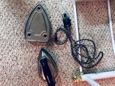 OLD UNIVERSAL ELECTRIC IRON WITH STAND, QUILT RACK, CLOTHES PINS, JAMES A MEGER ART THROW BLANKET