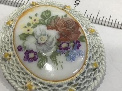 White With yellow Baby Rose with large Painted Floral Scence on Ceramic/porcelin.