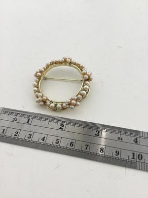 Gold tone round fashion pin