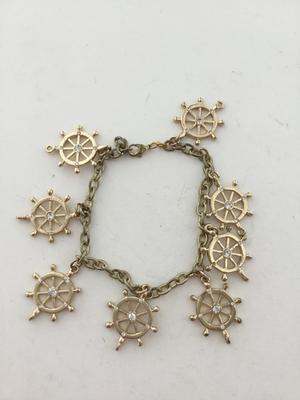 Gold tone wheel charm bracelet