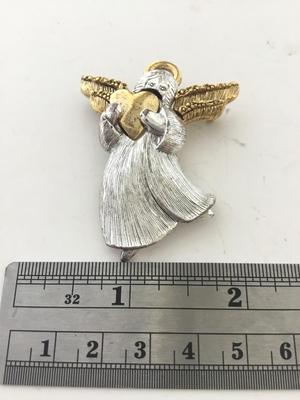 LC marked angel brooch
