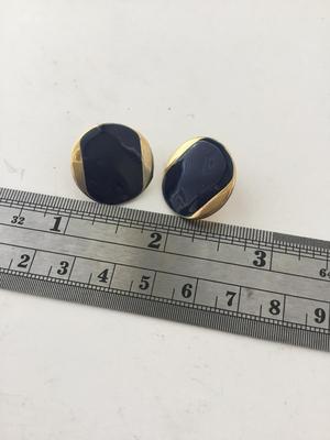 Gold tone round statement earrings