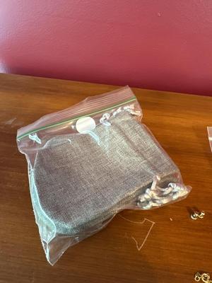Sale Photo Thumbnail #604: Miscellaneous jewelry lot, gift bags and silver polisher