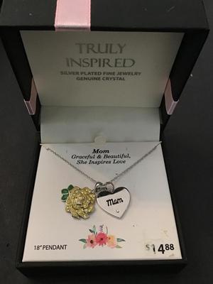 Silver tone necklace with heart pendant & flower charm