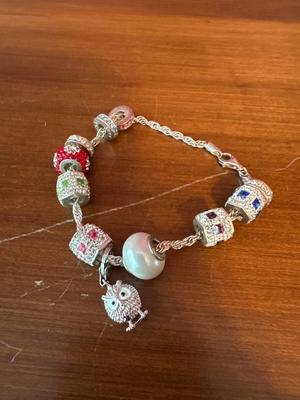 Sale Photo Thumbnail #620: Brooches and a bracelet