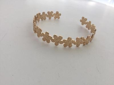 Beautiful gold tone flower cuff bracelet