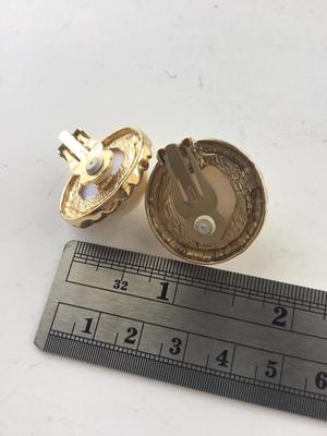Gold tone round vintage clip on beautiful earrings