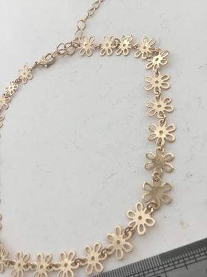 Gold tone choker flower necklace