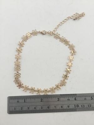 Gold tone choker flower necklace