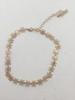Gold tone choker flower necklace