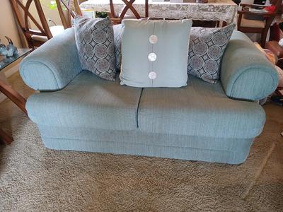Teal Upholstered Loveseat with Accent Pillows