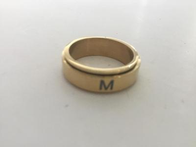 M. Marked gold tone ring