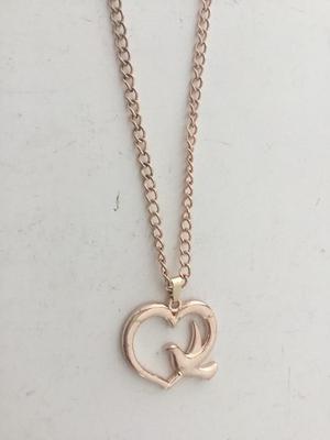 Gold tone bird and heart necklace