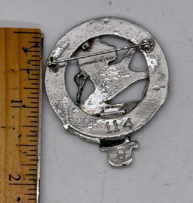 Sale Photo Thumbnail #231: Silvertone round metal cap Badge Pin. Approx. 1 5/8" across. Good condition.