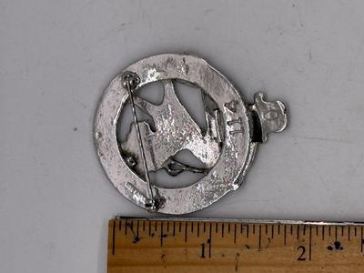 Sale Photo Thumbnail #232: Silvertone round metal cap Badge Pin. Approx. 1 5/8" across. Good condition.