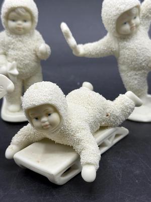 Sale Photo Thumbnail #338: All in good condition. There is what looks like a missing bump on the sledding figure's hip.