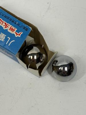 Sale Photo Thumbnail #406: 2 shiny chrome metal stress balls, Baoding balls, also known as Chinese meditation balls or health balls, are small, spherical tools used for promoting relaxation, improving hand dexterity, and enhancing overall well-being.