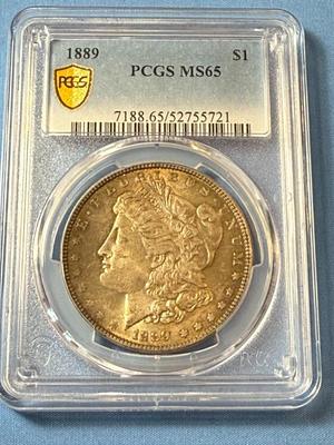 PCGS CERTIFIED 1889 MS65 TONED MORGAN SILVER DOLLAR AS PICTURED.