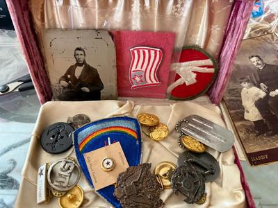 MISCELLANEOUS MILITARY BOX WITH DOG TAG, GLASS PICTURE. STERLING MILITARY PIN, ETC AS PICTURED.
