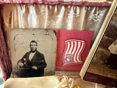 MISCELLANEOUS MILITARY BOX WITH DOG TAG, GLASS PICTURE. STERLING MILITARY PIN, ETC AS PICTURED.