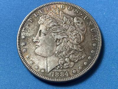 1884-P SLIDER UNCIRCULATED CONDITION TONED MORGAN SILVER DOLLAR (COIN #29).