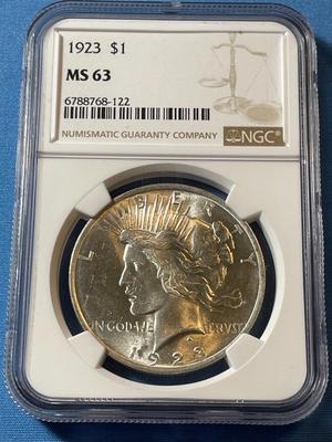 NGC CERTIFIED 1923 MS63 GRADED PEACE SILVER DOLLAR AS PICTURED.