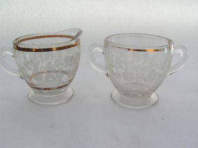 Decorative creamer and sugar bowl