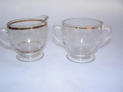 Decorative creamer and sugar bowl
