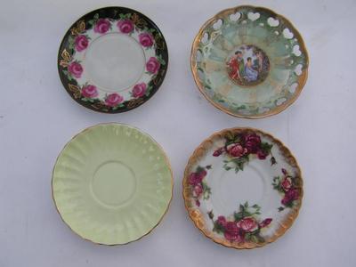 Lot of 4 decorative small plates & saucers