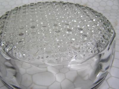 Vintage pressed glass bowl w/ chromed metal rim. About 9" dia.,
