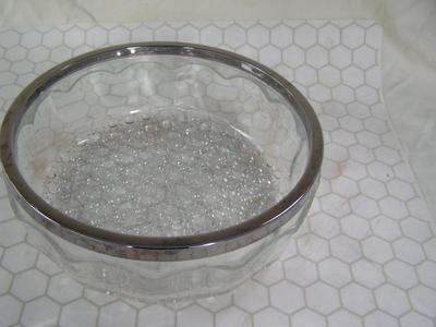 Vintage pressed glass bowl w/ chromed metal rim. About 9" dia.,