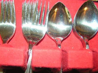 Rogers stainless steel flatware set in case. W/some misc pieces