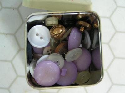 Two tins full of buttons & zippers & stuff